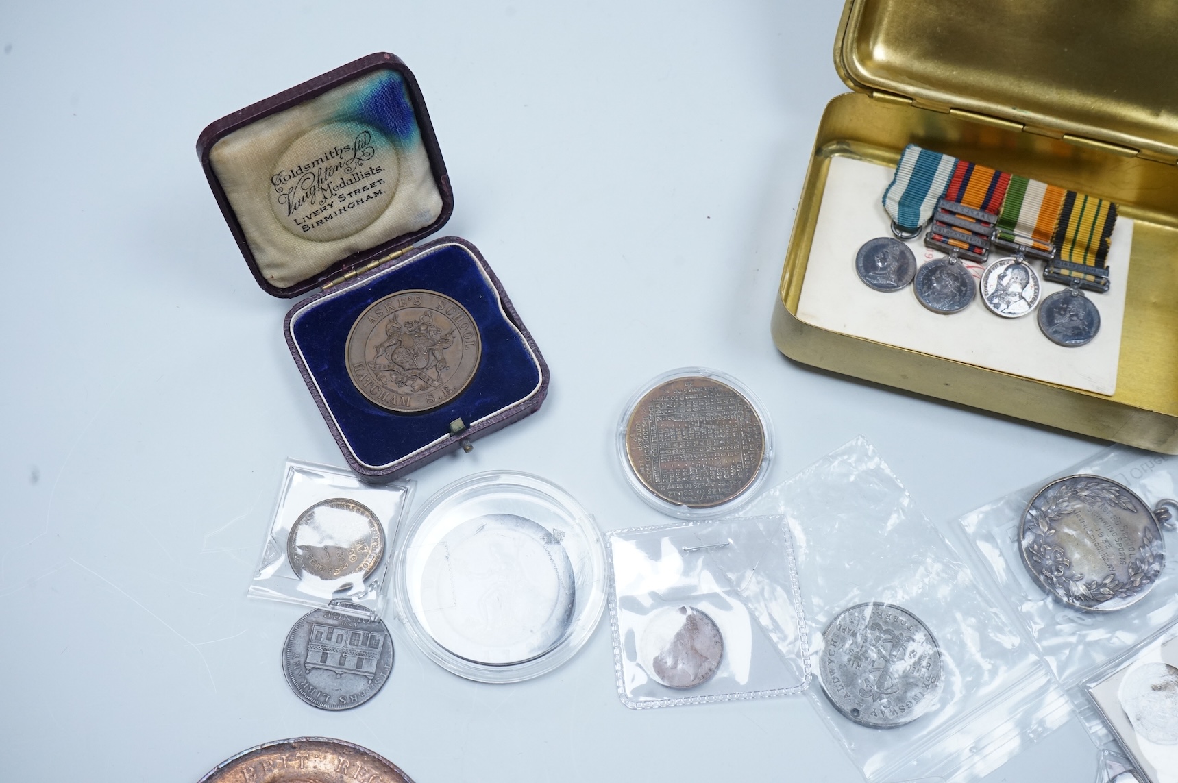 A QSA medal group miniature, comprising miniatures of; the Queen Victoria Golden Jubilee medal, the Queen’s South Africa medal with three clasps, the King’s South Africa medal with two clasps and the Africa General Servi